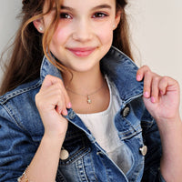 Sterling Silver Flower Pendant and Necklace on tween girl in denim jacket